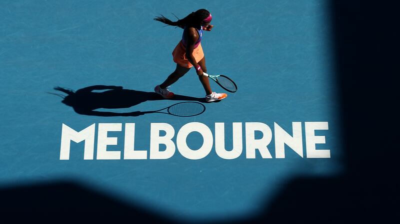 MELBOURNE, AUSTRALIA - JANUARY 17: Coco Gauff of United States celebrates a point in her first round singles match against Qiang Wang of China during day one of the 2022 Australian Open at Melbourne Park on January 17, 2022 in Melbourne, Australia. (Photo by Mark Metcalfe / Getty Images)