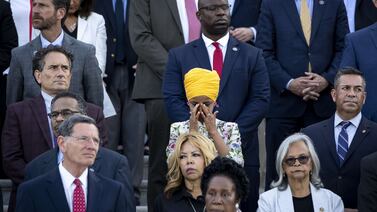 WASHINGTON, DC - JUNE 14: U. S.  Rep.  Ilhan Omar (D-MN) tears up as members of Congress hold a moment of silence for the 600,000 American lives lost to COVID-19, on the steps of the U. S.  Capitol on June 14, 2021.  The rate of severe illness and death continues to drop as more Americans get vaccinated.    Drew Angerer / Getty Images / AFP
