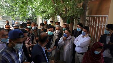Afghans wearing face masks to help curb the spread of the coronavirus line up to receive a Covid-19 vaccine in Kabul amid a rise in cases in Afghanistan. AP