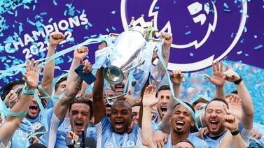 Manchester City's Fernandinho lifts the Premier League trophy.