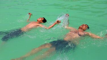 Men in Sanaa swim to cool down during a heatwave that hit Yemen. AFP