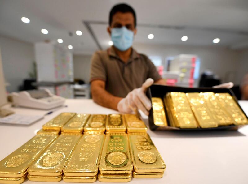 A jeweller showcases bars of gold at a shop at the Dubai Gold Souk. The UAE sees about 58.45 online searches each month for gold price per 1,000 active internet users, according to gold bar specialists PhysicalGold.com. AFP