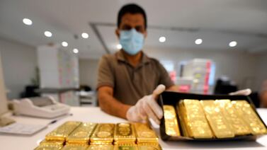 A jeweller showcases bars of gold at a shop at the Dubai Gold Souk. The UAE sees about 58.45 online searches each month for gold price per 1,000 active internet users, according to gold bar specialists PhysicalGold.com. AFP