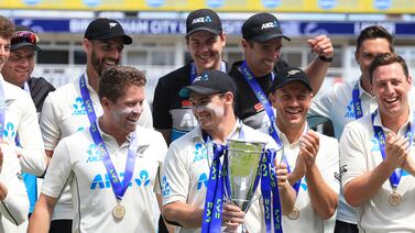 New Zealand's Tom Latham holds the trophy as his team celebrate winning the Test series against England in Edgbaston on Sunday, June 13. AFP