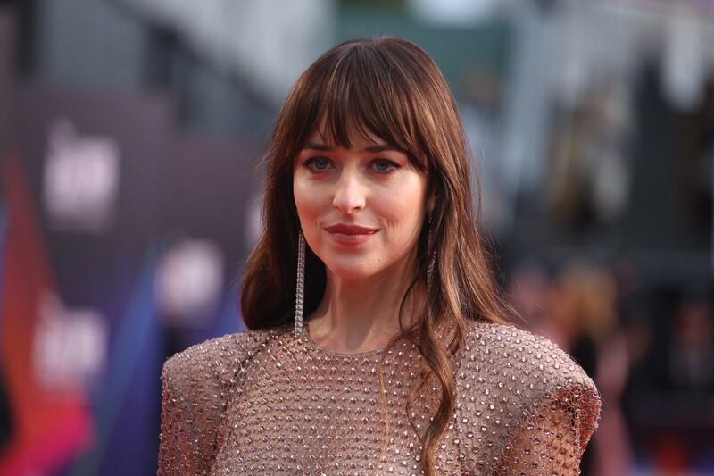 Dakota Johnson attends "The Lost Daughter" UK Premiere during the 65th BFI London Film Festival at The Royal Festival Hall on October 13, 2021 in London, England. Getty Images