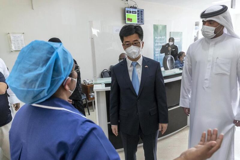 Li Xuhang, China’s consul general in Dubai, is introduced to medical staff as the Covid-19 vaccine drive for Chinese citizens begins