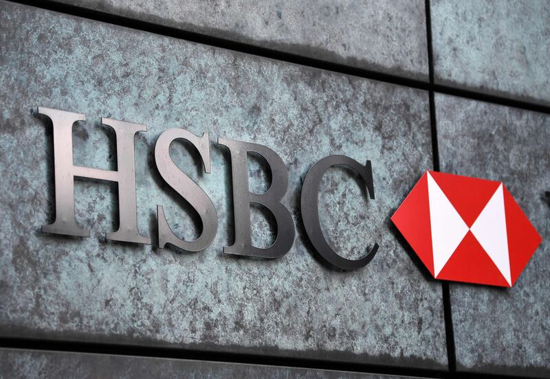 A logo of HSBC on its office wall. AFP
