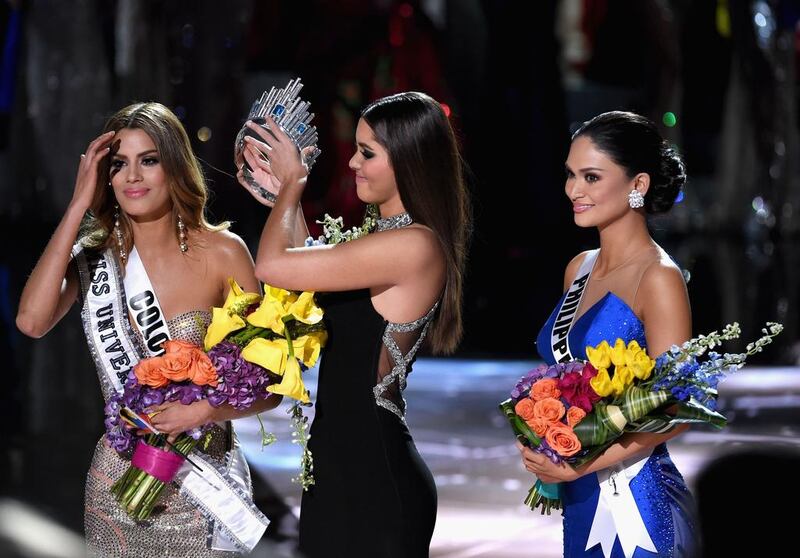 Miss Colombia 2015, Ariadna Gutierrez, has her crown removed by Miss Universe 2014, Paulina Vega, and given to Miss Phillipines 2015, Pia Alonzo Wurtzbach after a mix-up by the hosts. Ethan Miller / Getty Images / AFP