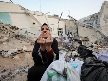 A woman reacts as she inspects damages at Al Shifa Hospital after Israeli forces withdrew from the hospital and the area around it after a two-week operation. Reuters