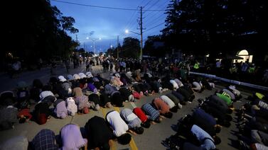 People pray following a vigil after four members of a Muslim family were killed in what police describe as a hate-motivated attack in London, Ontario, Canada, June 8, 2021.  Reuters