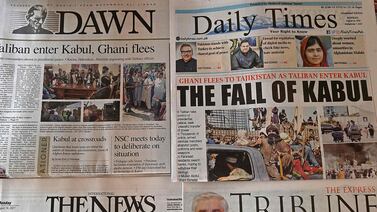 Pakistan's newspapers are pictured displaying front page news about Afghanistan, at a stall in Islamabad on August 16, 2021 after the Taliban were in control of Afghanistan after President Ashraf Ghani fled the country and conceded the insurgents had won the 20-year war.  (Photo by Aamir QURESHI  /  AFP)