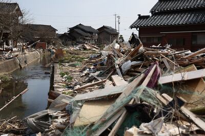 This photo shows a general view of the debris and damage in Noto Town, Ishikawa prefecture on March 31, 2024 three months after the New Year's earthquake and tsunami.  (Photo by JIJI Press  /  AFP)  /  Japan OUT