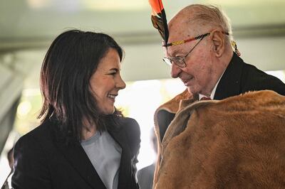 Germany's Minister for Foreign Affairs Annalena Baerbock (L) talks to Lewis O’Brien, the oldest living Kuarna man, during a ceremony to mark the return of four significant cultural heritage items to the Kaurna People from the collection of the Grassi Museum in Leipzig, at Possum Park in Adelaide on May 3, 2024.  (Photo by MICHAEL ERREY  /  POOL  /  AFP)