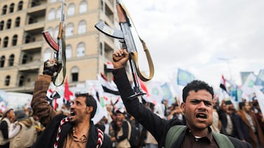 Supporters of Yemen's Houthis hold up their rifles as they rally to celebrate the seventh anniversary of the ousting of the government in Sanaa, Yemen, on September 21, 2021. Reuters