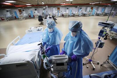 Nurses care for a Covid-19 patient. Reuters