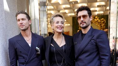Adam Senn, Sharon Stone and Sam Webb attend a photocall during a Dolce & Gabbana boutique event during the Milan Fashion Week Fall/Winter 2022/2023 on February 26, 2022 in Milan, Italy. Getty Images