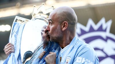 Manchester City manager poses with the Premier League title trophy following City's 3-1 win over West Ham United at Etihad Stadium on May 19, 2024 in Manchester, England. Getty