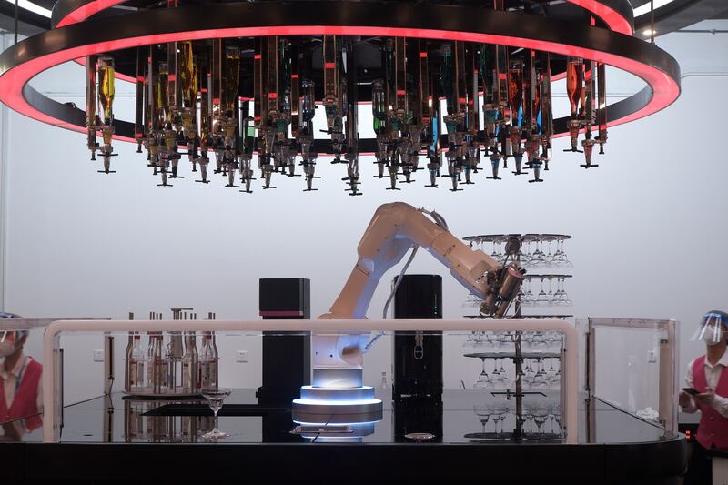 A robotic arm prepares drinks at the bar area of the Main Media Centre on day 13 of 2022 Beijing Winter Olympics on February 17, 2022. Getty Images