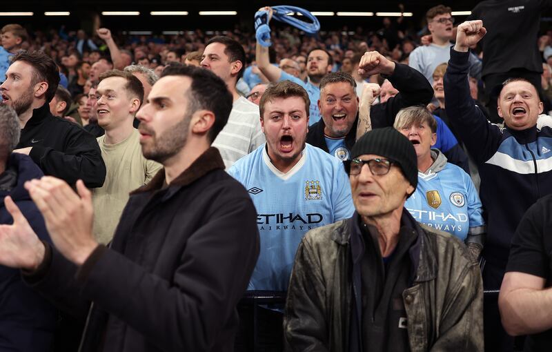  Manchester City fans show their support after they went 1-0 up. Getty 