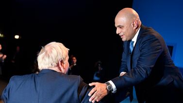 Sajid Javid (right) is thanked by Prime Minister Boris Johnson in 2019. EPA