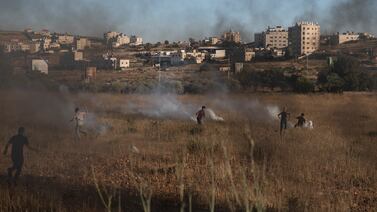 Israeli soldiers use tear gas to disperse Palestinian protesters near the West Bank city of Ramallah. AP