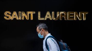HONG KONG, CHINA - 2021/08/10: A pedestrian walks past the French luxury fashion brand Yves Saint Laurent (YSL) store seen in Hong Kong. (Photo by Budrul Chukrut / SOPA Images / LightRocket via Getty Images)