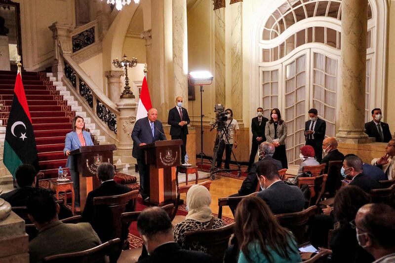 Egypt's Foreign Minister Sameh Shoukri (C-R) and his Libyan counterpart Najla al-Mangoush (C-L) give a joint press conference after their meeting in the capital Cairo on June 19, 2021.  (Photo by Khaled DESOUKI  /  AFP)