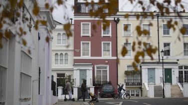 A pedestrian walks past residential houses in Notting Hill in London. Britain's stamp duty holiday ends on June 30. Bloomberg