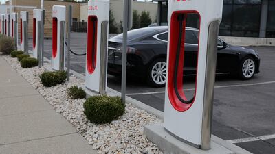 Tesla electric vehicles are charged at a Tesla Supercharger charging station in South Korea. Goldman Sachs forecasts sales of EVs to grow by 32 per cent annually this decade. Reuters