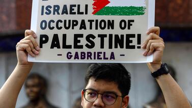 A pro-Palestine demonstrator holds a sign during a rally marking Nakba Day in Quezon City, Metro Manila, Philippines, 15 May 2024.  Palestinians marked the 76th anniversary of Nakba Day (Day of the Catastrophe), commemorated annually on 15 May to remember their displacement following the 1948 Israeli Declaration of Independence.   EPA / ROLEX DELA PENA