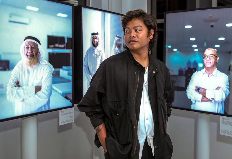 Augustine Paredes in front of his work during the exhibition launch for 50 Years of Cool. Victor Besa / The National