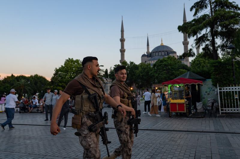 Turkish police officers patrolling in front of the Blue Mosque in Istanbul on Tuesday. AFP