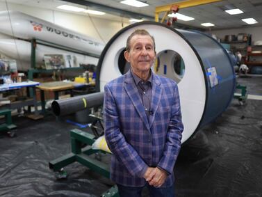 Markus Rufer, President and CEO of Scorpius, stands next to a tank, an all-composite pressure vessel, in which a similar one will be used on the next mission to the moon, at Scorpius Space Launch Company in Torrance, California, on February 7, 2024.  Scorpius Space Launch Company specializes in rocket propulsion components for pressure-fed launch vehicles, including all-composite pressure vessels that have application for spacecraft and rockets.  (Photo by David SWANSON  /  AFP)