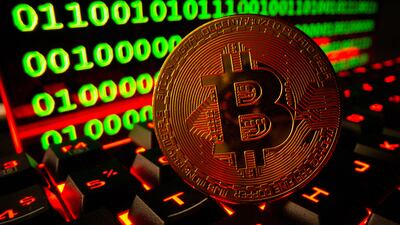 FILE PHOTO: Bitcoin cryptocurrency representation is pictured on a keyboard in front of binary code in this illustration taken September 24, 2021.  REUTERS / Dado Ruvic / Illustration / File Photo