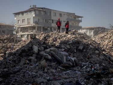 Rescue workers oversee an operation from the top of a pile of rubble on February 15, 2023 in Hatay, Turkey. Getty Images