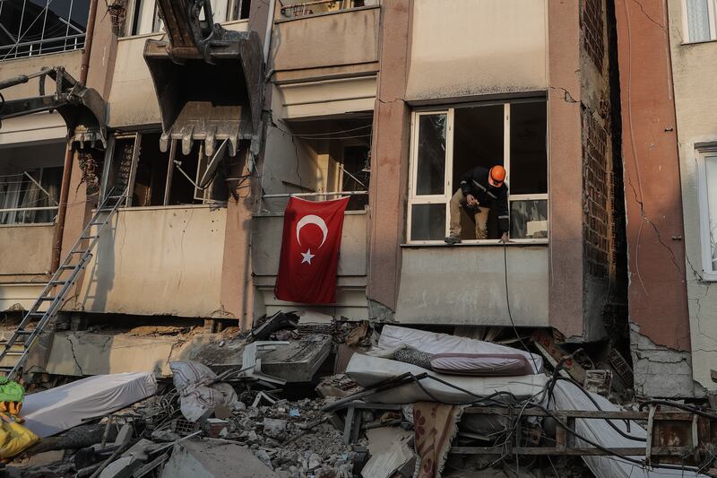 HATAY, TURKEY - FEBRUARY 13: A rescuer checks a partly damaged building on February 13, 2023 in Hatay, Turkey. A 7.8-magnitude earthquake hit near Gaziantep, Turkey, in the early hours of Monday, followed by another 7.5-magnitude tremor just after midday. The quakes caused widespread destruction in southern Turkey and northern Syria and were felt in nearby countries. (Photo by Burak Kara / Getty Images)