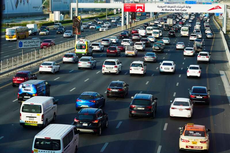 Vehicles pass under a toll gate on Sheikh Zayed Road in Dubai on Monday, September 5, 2022. Toll gate operator Salik is set to raise more than $1bn after it became the latest state-linked company to list. AP