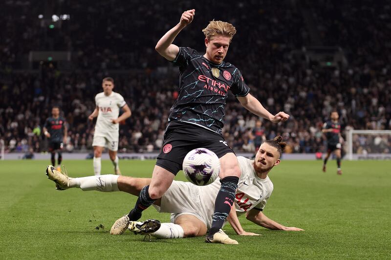 Kevin De Bruyne of Manchester City is challenged by Radu Dragusin. Getty