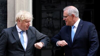 British Prime Minister Boris Johnson bumps elbows with Australia's Scott Morrison at Downing Street in London. Reuters
