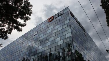 A logo of ride-hailing giant Didi Chuxing is seen on Didi Chuxing's building in Beijing, China, 03 July 2021.  According to the statement by the cybersecurity review office published on 02 July, China's ride-hailing giant Didi Chuxing Technology Company goes under a cybersecurity review based on the National Security Law and Cybersecurity Law.  The investigation started two days after Didi raised 4. 4 billion USD in The United States' initial public offering.   EPA / WU HONG