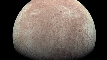 This image provided by NASA, processed by Kevin M.  Gill, shows Jupiter's moon Europa captured by the Juno spacecraft on Sept.  29, 2022, with north to the left.  Research published Monday, March 4, 2024, suggests there's less oxygen on the icy surface of Jupiter's moon Europa than thought — and that could affect what if any life might be lurking in the moon’s underground ocean.  (Kevin M.  Gill / NASA / JPL-Caltech / SwRI via AP)
