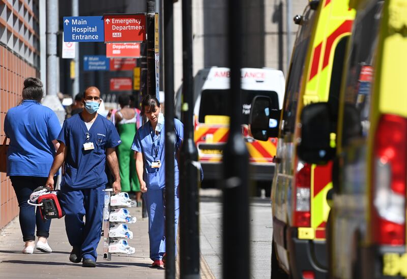National Health Service staff outside the Royal London Hospital. British Prime Minister Boris Johnson has announced a delay to lockdown easing. The UK government will delay England's full reopening for a further four weeks owing to a significant rise in Delta variant Covid-19 cases.  EPA