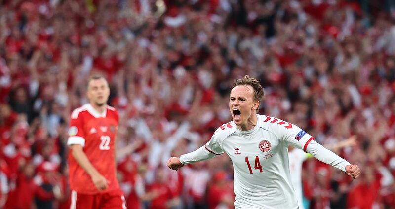 Denmark's Mikkel Damsgaard celebrates scoring their first goal against Russia. EPA