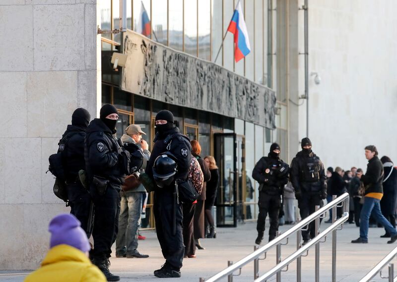 Police officers keep watch outside the Oktyabrsky Concert Hall, amid heightened security measures in the wake of a terrorist attack at the Crocus City Hall concert venue, prior to the concert of the rock group 'Picnic' in St.  Petersburg, Russia. EPA