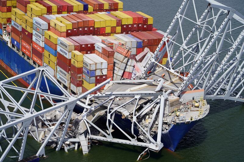 Aerial view of the Dali cargo vessel which crashed into the Francis Scott Key Bridge, causing it to collapse in Baltimore, Maryland, U. S. , March 26, 2024.  Maryland National Guard/Handout via REUTERS.  THIS IMAGE HAS BEEN SUPPLIED BY A THIRD PARTY        TPX IMAGES OF THE DAY