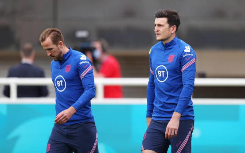 BURTON UPON TRENT, ENGLAND - JUNE 10: Harry Kane and Harry Maguire of England walk out prior to the England Training Session at St George's Park on June 10, 2021 in Burton upon Trent, England. (Photo by Catherine Ivill / Getty Images)