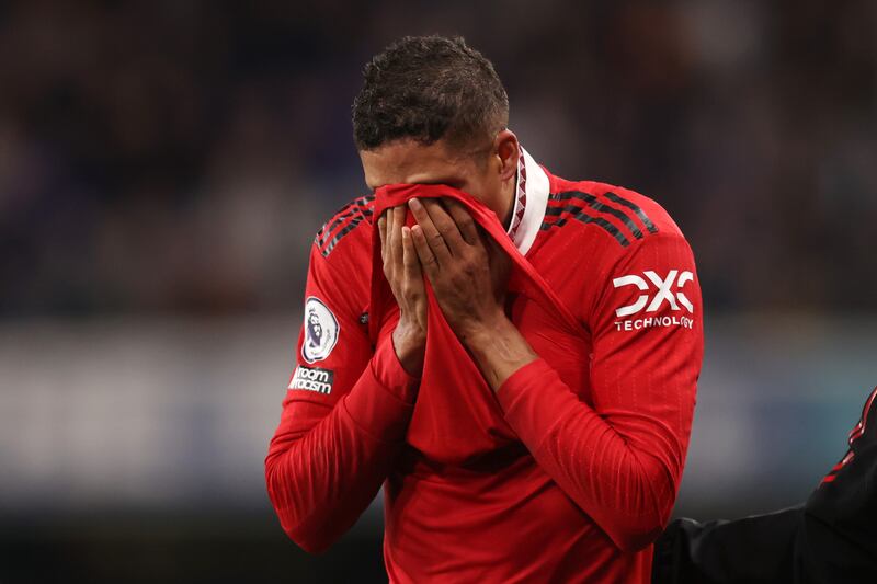 Raphael Varane leaves the pitch with an injury during the Premier League match between Chelsea and Manchester United at Stamford Bridge on October 22, 2022 in London, England. Alex Pantling / Getty Images