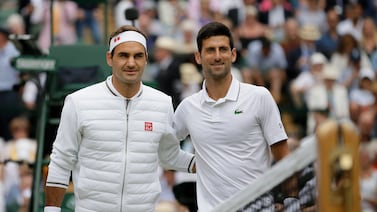 Roger Federer, left, and Serbia's Novak Djokovic before the 2019 Wimbledon final. AP