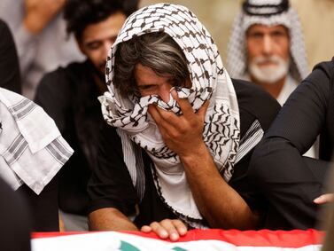 Mourners gather at the coffin of an Iraqi soldier killed in an attack in Najaf on Tuesday. Reuters