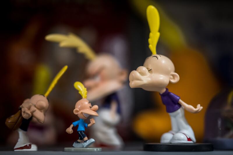 Figurines of the character of Titeuf are seen at the house of Swiss cartoonist Philippe Chappuis better known as Zep during an interview with AFP in Geneva, on May 1, 2024.  "Comics have become my profession and music has always been my hobby and for several years it has taken up more space".  More than 30 years after creating the famous comic book character Titeuf, Swiss cartoonist Zep explores his other passion, music, in a pop-folk album.  (Photo by Fabrice COFFRINI  /  AFP)